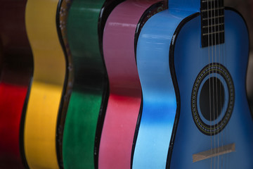 Multiple Colorful Acoustic Guitars
