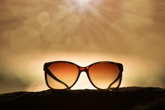 Sunglasses at Sunset and Rays of Sunlight