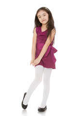 The dark-haired girl in purple dress