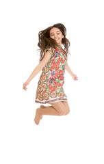 Beautiful girl jumps legs crossed.