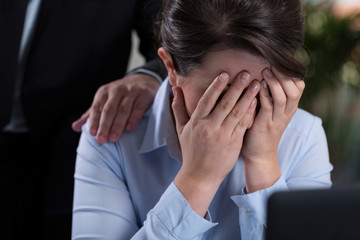 Woman crying in the office