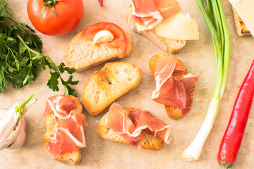 Pintxos with prosciutto and tomato
