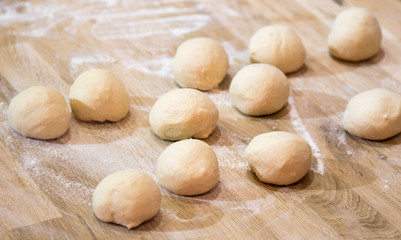 Fototapeta na wymiar dough on a table with flour