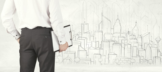 Businessman with drawn city view