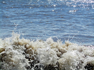 Small waves splashing on to the beach