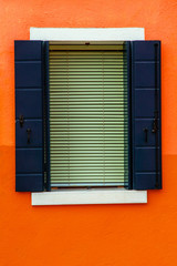 Colorful window of a house on the Venetian island of Burano