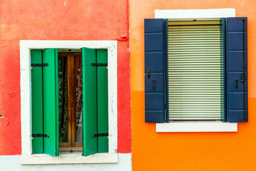 Fototapeta na wymiar Colorful window of a house on the Venetian island of Burano
