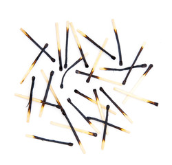 Burned matches on white background