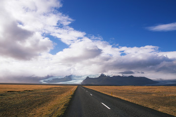 Obraz na płótnie Canvas Road meets Vatnajokull glacier in Iceland