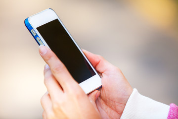 Hand holding White Smartphone