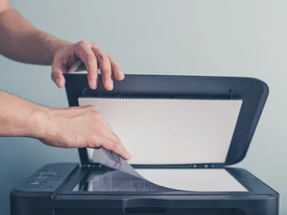 Foto op Plexiglas Hands of a man copying a piece of paper © LoloStock