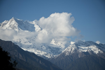 Clouds over the snowcapped mountains, Himalayas, Uttarakhand, In
