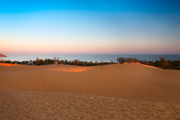 Red sand dunes in Mui Ne at sunset, Vietnam