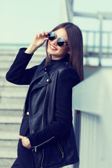 fashion model in sunglasses posing outdoor