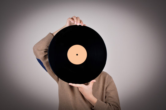 Young boy holding a vinyl record