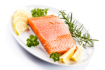 Fresh raw salmon steak on white background