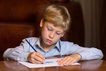 Boy drawing on paper