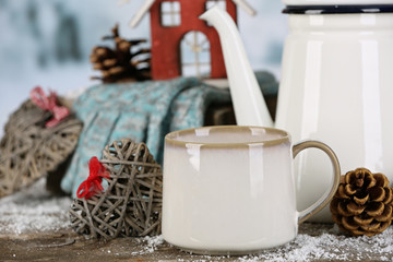 Winter composition with hot beverage on nature background