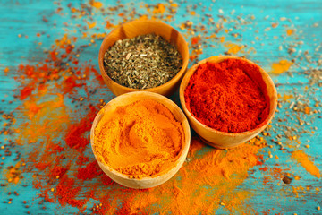 Different seasoning in wooden bowls