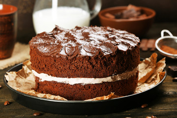 Fototapeta na wymiar Delicious chocolate cake on table close-up