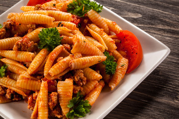 Pasta with meat, tomato sauce and vegetables