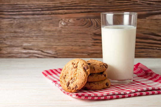 glass of milk and tasty cookies