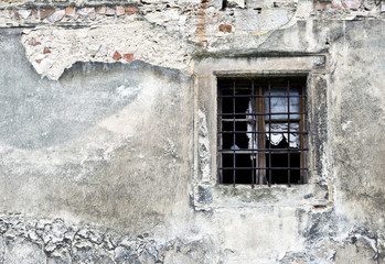 Fototapeta na wymiar Old broken window part of decaying building