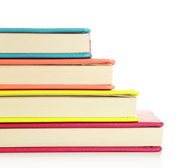 Colorful notebooks, isolated on white
