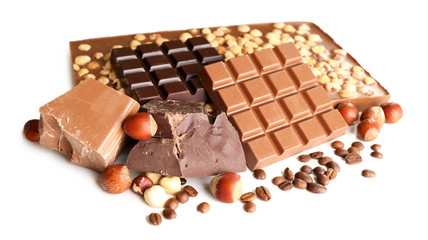 Chocolate bars with hazelnuts and coffee beans isolated on