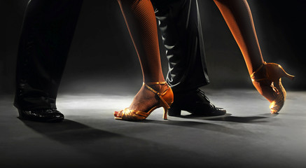 Feet partners on black background