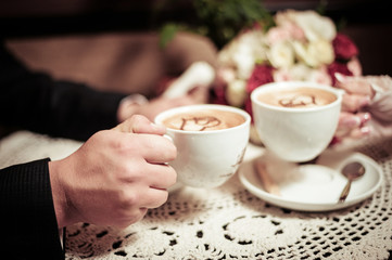 Newlyweds drinking coffee