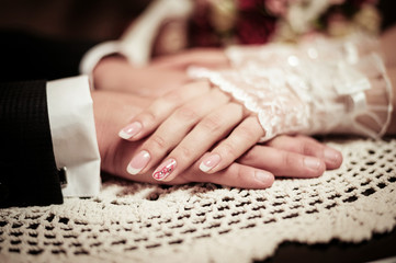 Newlyweds holding hands