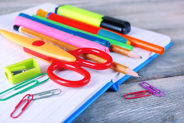 Colorful stationery on wooden table, closeup