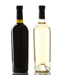 Red and white wine bottles isolated on white