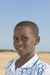 Afro boy at the beach, ten years old 