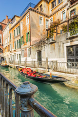 Fototapeta na wymiar Lovely canal with gondola in Venice