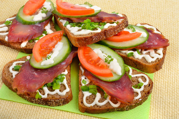 Sandwich with smoked meat and vegetables