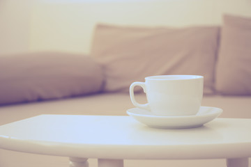 Fototapeta na wymiar coffee cup in bed room vintage warm color tone
