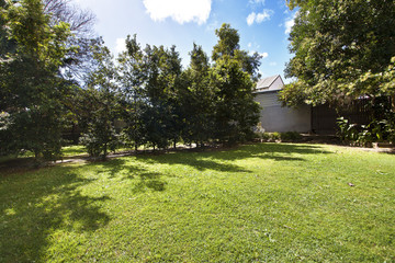 Backyard cozy patio area with wicker furniture set
