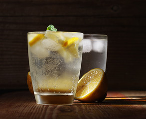 Cold fresh lemonade on the woden table