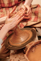 Shaping cay on pottery wheel
