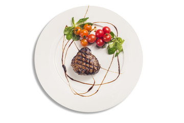 Grilled Sirloin Steak with Tomatoes on White Plate