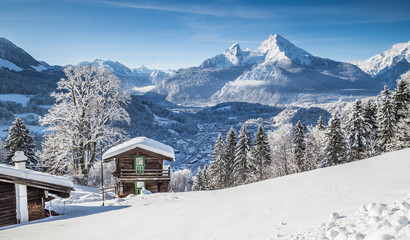 Idyllic winter landscape the Alps with mountain chalet