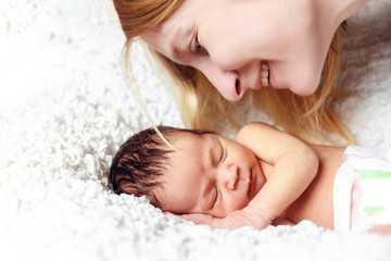 Obraz na płótnie Canvas Mother and newborn baby close-up