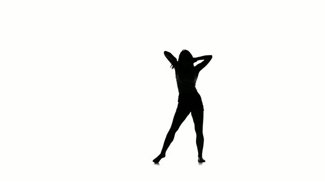 Sexy dancer woman dancing on white background, slow motion