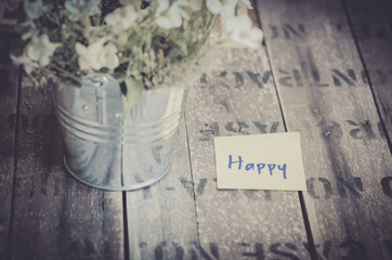 vintage style effect Happy message on  wooden background