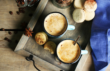 Beautiful composition with tasty cappuccino on wooden table
