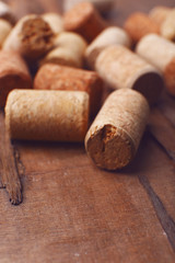 Wine corks on rustic wooden table background