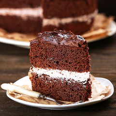 Delicious chocolate cake on table close-up