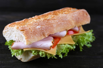 Fresh and tasty sandwich with ham and vegetables